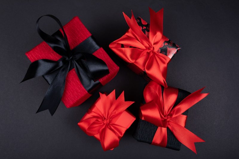 Gift boxes of black and red color with black and red ribbon attached. Corporate gifting at its best.