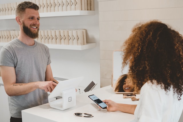 A happy customer talking to counter girl